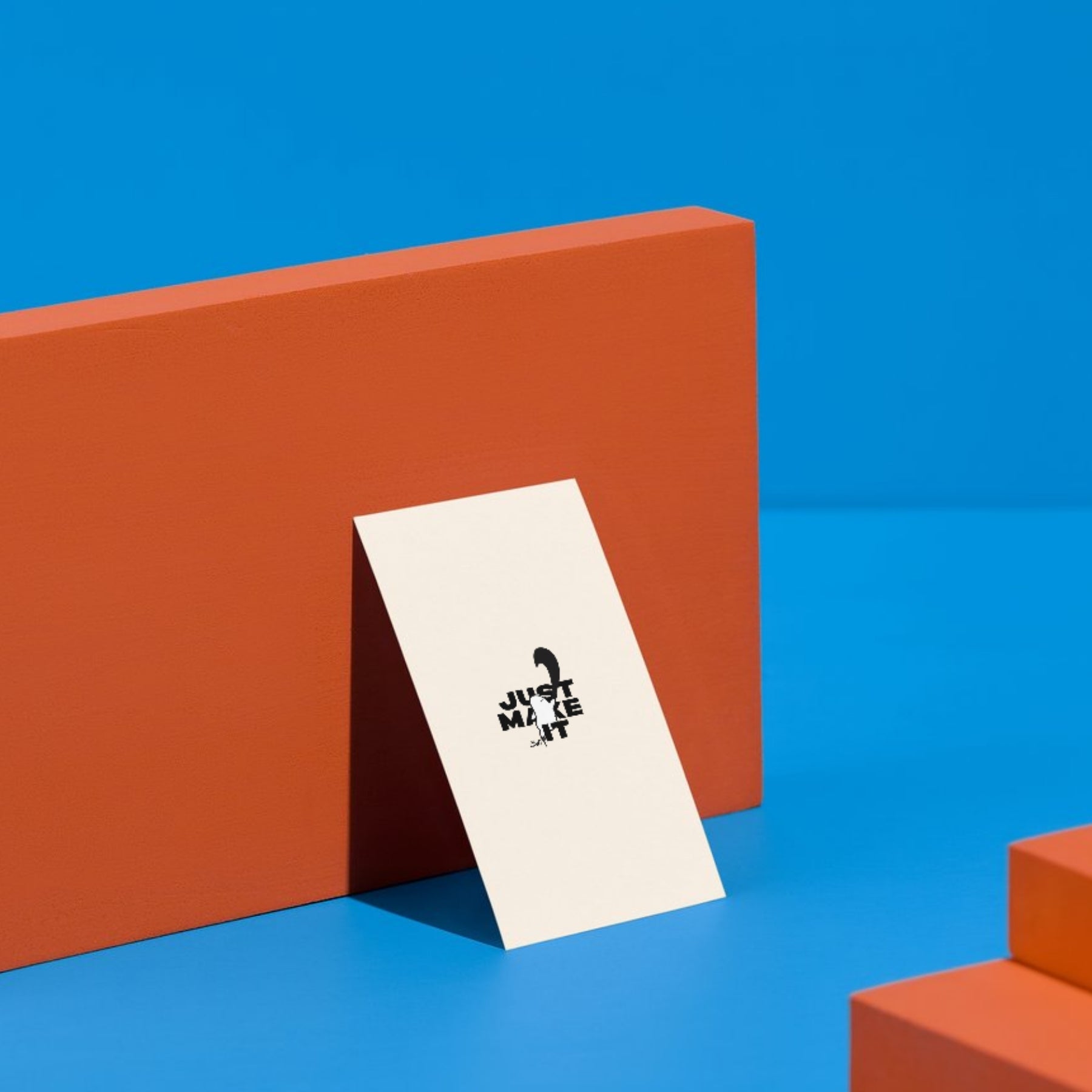  Mockup of the “Just Make Shit” card standing against a neutral wall, showcasing the card in a styled space