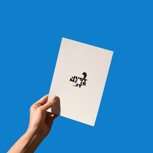 A hand holding the “Just Make Shit” Bobby Blob card, giving a sense of scale and real-life use