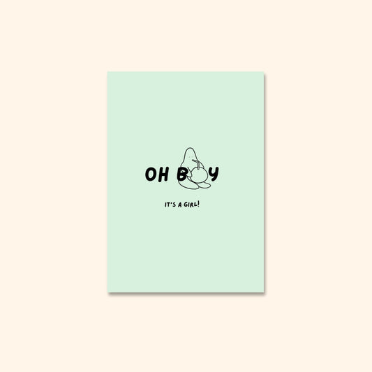 A baby blob drinks out of a massive coconut under the words “Oh boy, it’s a girl!” in playful, bold lettering.