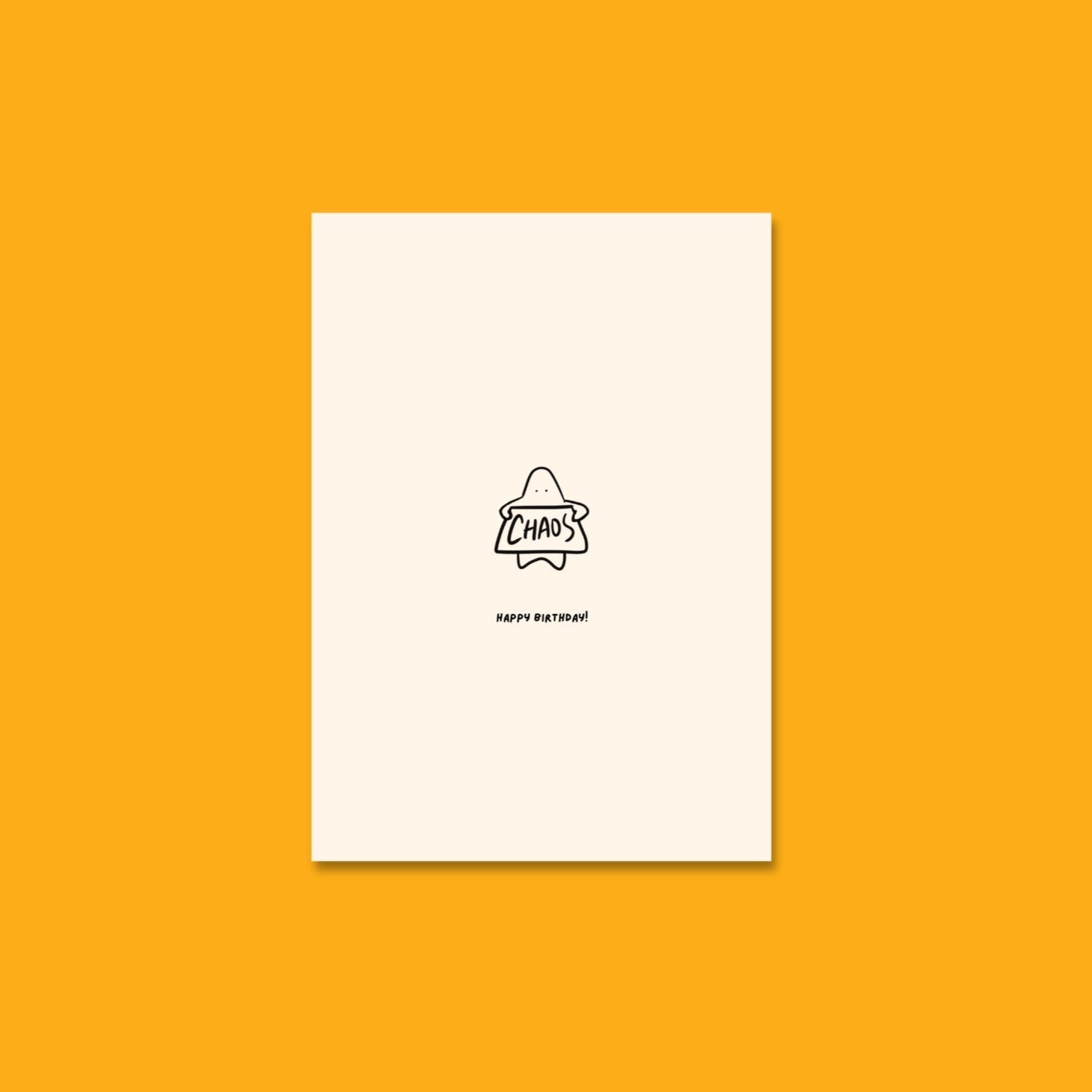 Front of the Bobby Blob birthday card showing a blobby character holding a sign that reads 'CHAOS' with a cheeky grin