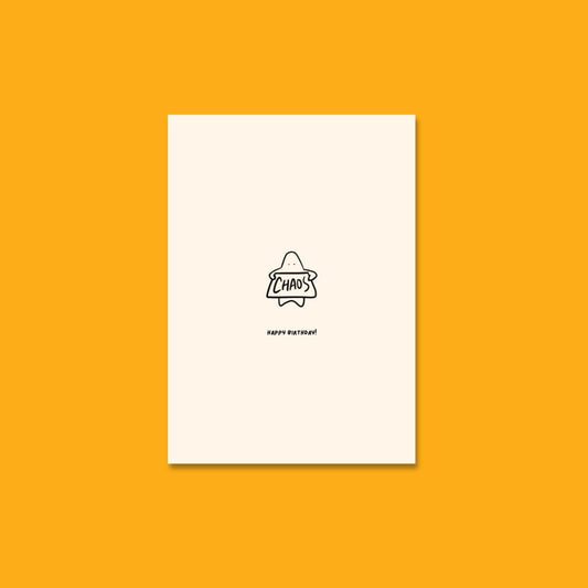 Front of the Bobby Blob birthday card showing a blobby character holding a sign that reads 'CHAOS' with a cheeky grin